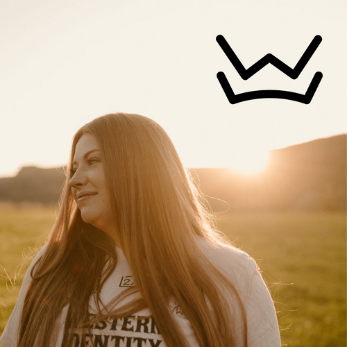 Photo of Kate Biaggi in a pasture with a W Over Crown Brand imposed on the image.