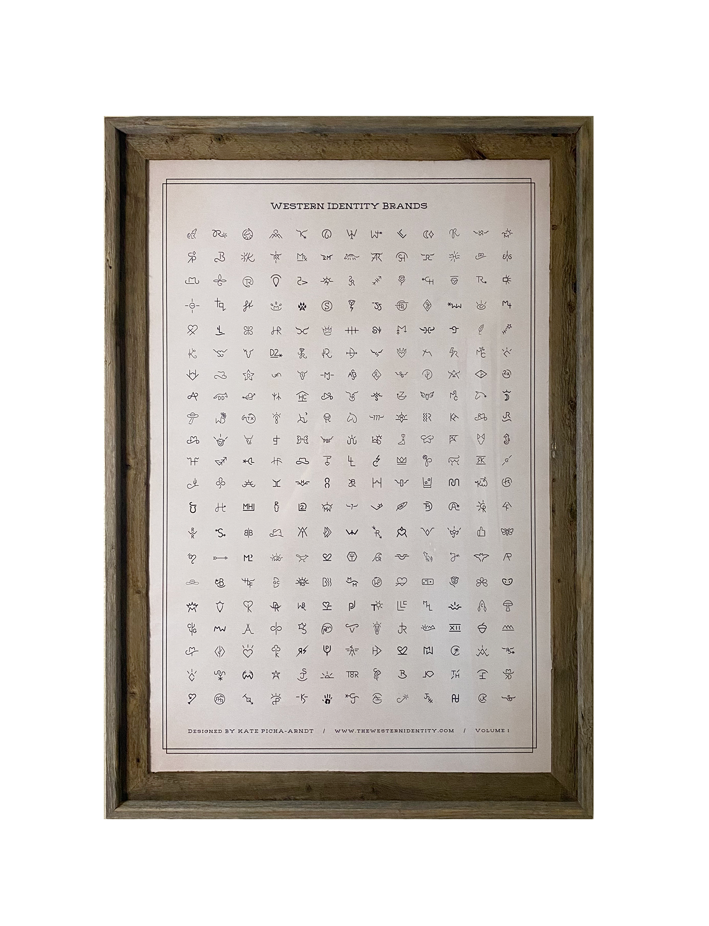 Barnwood framed poster print with 273 Western Identity Brand designs on a rustic off-white background. This image shows Volume 1 of the Western Identity Brand Design Archives.