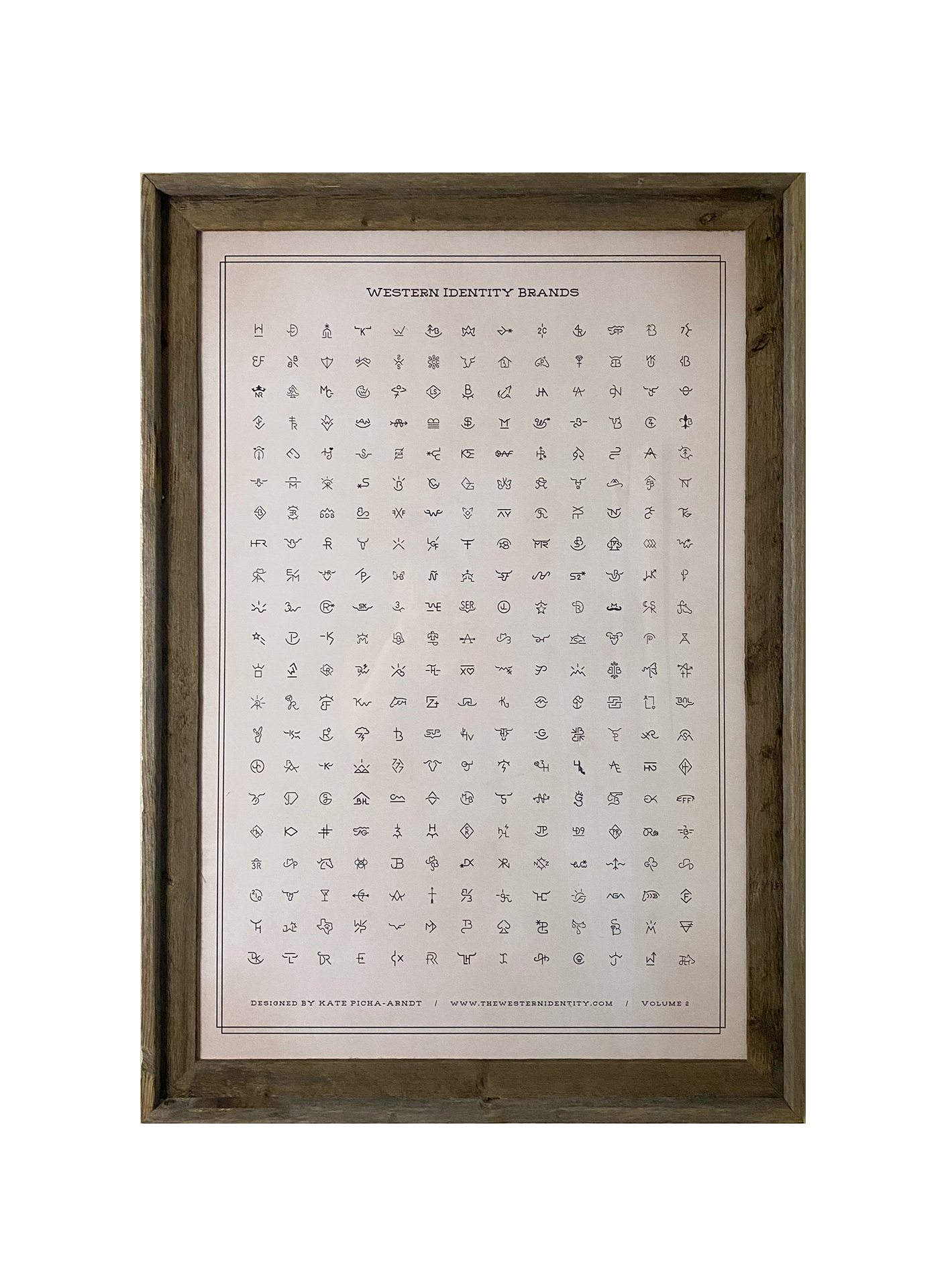 Barnwood framed poster print with 273 Western Identity Brand designs on a rustic off-white background. This image shows Volume 1 of the Western Identity Brand Design Archives.